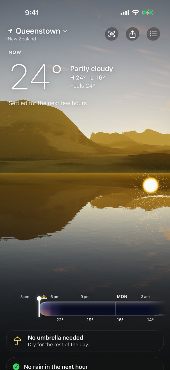 Weatherglass at golden hour in Queenstown: 24 degrees and partly cloudy, the low sun glittering on the lake below the mountains